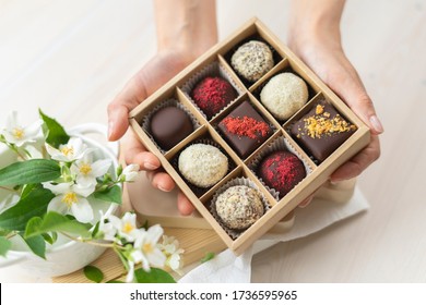 hands-box-chocolates-holds-assorted-260nw-1736595965.jpg