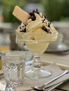 640px-Ice_cream_with_whipped_cream,_chocolate_syrup,_and_a_wafer_(cropped) (1).jpg