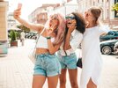three-young-beautiful-smiling-female-trendy-summer-clothessexy-carefree-multiracial-women-posi...jpg