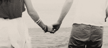 couple-hold-hands-aesthetic-beach-6w2g2rl8l37yoxrb.gif