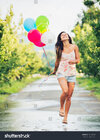 stock-photo-beautiful-happy-girl-holding-balloons-150416126.jpg