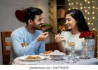 happy-young-couple-enjoying-dinner-260nw-2267781839.jpg