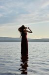 beautiful-woman-light-red-dress-stands-water-lake-sea-sunset-reflection-girl-sky-water_91497-7...jpg