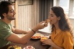 boyfriend-girlfriend-eating-waffles-together-home_23-2149206179.jpg