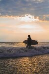 woman-surfer-with-surfboard-ocean-sunset_1321-4264.jpg